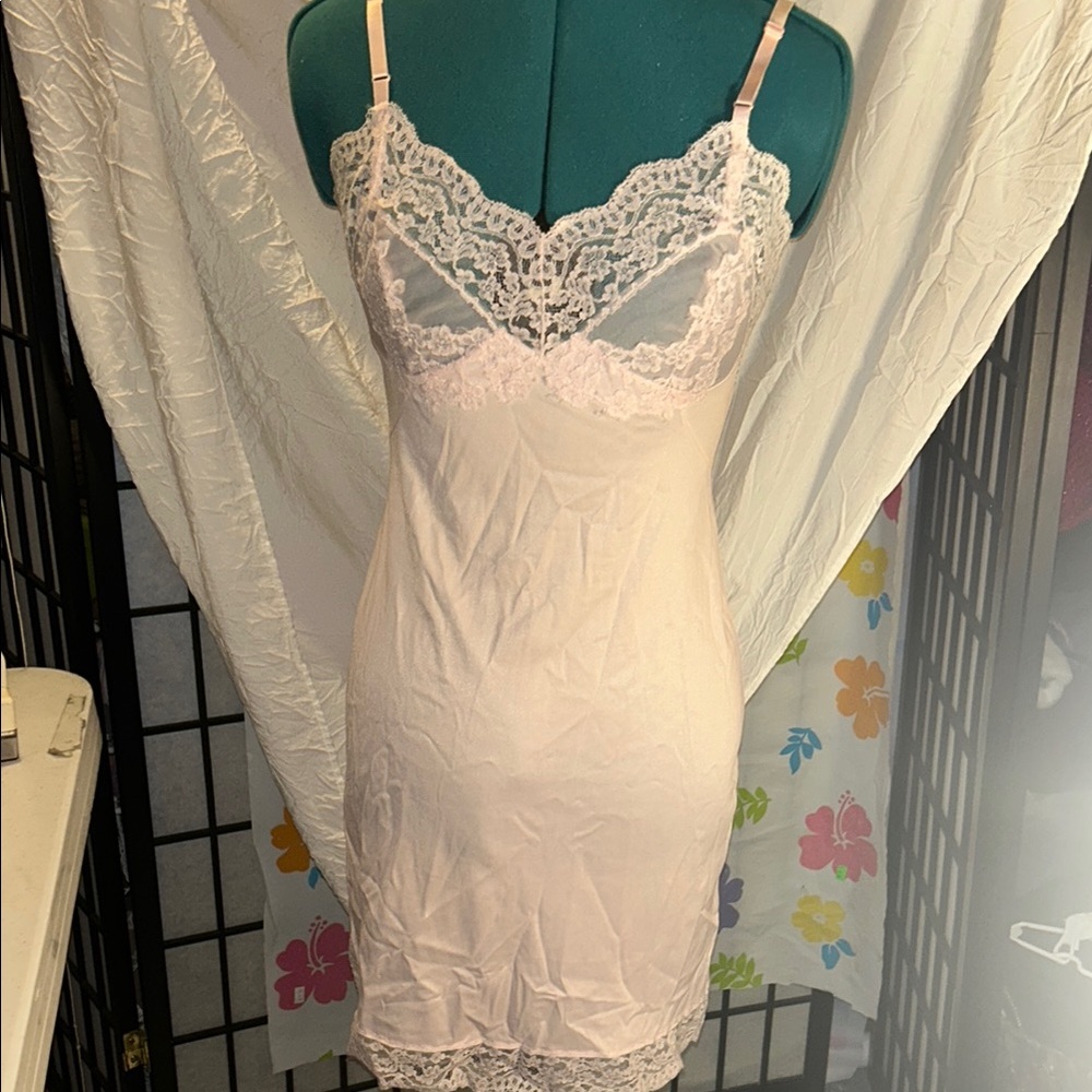 Elegant Lace Trim slip in Soft Pink size small.  Adjustable straps